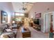 Bright living room with comfortable sofa, wooden furniture, and an open floor plan at 458 Meadowood Blvd, Fern Park, FL 32730
