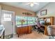 Dedicated office space with a large desk, comfortable chair and natural light at 458 Meadowood Blvd, Fern Park, FL 32730