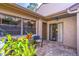 Comfortable brick patio area featuring outdoor seating with views of lush greenery and natural light at 458 Meadowood Blvd, Fern Park, FL 32730