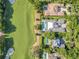Expansive aerial view showing the property's location on a golf course, surrounded by lush greenery at 5157 Latrobe Dr, Windermere, FL 34786