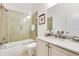 Neutral bathroom featuring a vanity with marble counters, toilet, and tiled tub shower at 5157 Latrobe Dr, Windermere, FL 34786