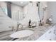 Bathroom featuring double vanity with granite countertops, and decorative framed mirrors with sconces at 5157 Latrobe Dr, Windermere, FL 34786