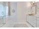 Elegant bathroom featuring marble flooring, white vanity, and a standalone tub at 5157 Latrobe Dr, Windermere, FL 34786