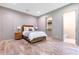 Bedroom with rustic wood floors and view to the walk-in closet at 5157 Latrobe Dr, Windermere, FL 34786