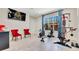 Home gym featuring wall-mounted flat screen TV and custom equipment at 5157 Latrobe Dr, Windermere, FL 34786