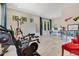 Spacious exercise room leading to desk area, with fitness equipment and a beverage cooler at 5157 Latrobe Dr, Windermere, FL 34786