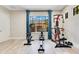 Home gym with stationary bike, rowing machine, and weight-lifting equipment at 5157 Latrobe Dr, Windermere, FL 34786