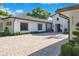 Exterior shot of beautiful home showing brick paver driveway and tidy landscaping at 5157 Latrobe Dr, Windermere, FL 34786