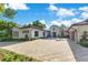 Stunning exterior view of home showcasing paver driveway and lush landscaping at 5157 Latrobe Dr, Windermere, FL 34786