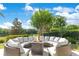 Inviting outdoor fire pit with cushioned seating, perfect for entertaining or enjoying quiet evenings at 5157 Latrobe Dr, Windermere, FL 34786