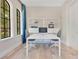 Bright office with white table, shelves, and natural light at 5157 Latrobe Dr, Windermere, FL 34786