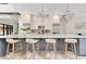 Kitchen island with seating, gray cabinets, and unique lighting at 5157 Latrobe Dr, Windermere, FL 34786