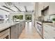 Elegant kitchen with marble countertops, stainless steel appliances, and custom cabinetry at 5157 Latrobe Dr, Windermere, FL 34786