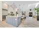 Bright, open concept kitchen with island seating and stainless steel appliances at 5157 Latrobe Dr, Windermere, FL 34786