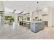 Spacious kitchen with center island and barstools in an open concept design at 5157 Latrobe Dr, Windermere, FL 34786