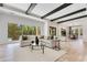 Bright living room with exposed beams and a view to the outdoor living space at 5157 Latrobe Dr, Windermere, FL 34786