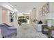 Bright living room featuring modern furnishings, artwork, and an open floor plan leading into the kitchen at 5157 Latrobe Dr, Windermere, FL 34786