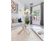 Bright living room featuring modern decor, neutral tones, and a large window at 5157 Latrobe Dr, Windermere, FL 34786