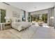 Bright main bedroom featuring neutral decor, sitting area and backyard views at 5157 Latrobe Dr, Windermere, FL 34786