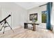 Bright and airy office featuring a marble desk, modern chair, and telescope at 5157 Latrobe Dr, Windermere, FL 34786