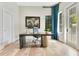Well-lit office space featuring a marble desk, decor, rolling chair, and window at 5157 Latrobe Dr, Windermere, FL 34786