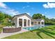 Beautiful home with a luxurious pool, fire pit, and a large backyard, perfect for outdoor living and entertaining at 5157 Latrobe Dr, Windermere, FL 34786