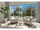 Cozy sitting area with pool view and natural light at 5157 Latrobe Dr, Windermere, FL 34786
