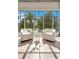 Comfortable sitting area with a view of the pool and lush greenery at 5157 Latrobe Dr, Windermere, FL 34786