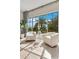 Bright sitting area with pool view, neutral tones, and natural light at 5157 Latrobe Dr, Windermere, FL 34786