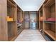 Custom walk-in closet with wood shelving and plenty of storage at 5157 Latrobe Dr, Windermere, FL 34786