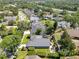 Aerial view of the home showing fenced yard, landscaping, patio and neighborhood at 5335 Bay Side Dr, Orlando, FL 32819