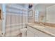 Cozy bathroom with shower, white vanity and coastal-themed decor at 5335 Bay Side Dr, Orlando, FL 32819