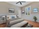 Bright bedroom with hardwood floors, ceiling fan, and tastefully decorated walls at 5335 Bay Side Dr, Orlando, FL 32819