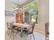 Elegant dining area filled with light, complemented by stylish decor and ample seating at 5335 Bay Side Dr, Orlando, FL 32819