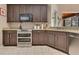 Contemporary kitchen features stainless steel appliances, granite countertops, and plentiful cabinet space at 5335 Bay Side Dr, Orlando, FL 32819