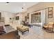 Comfortable living room with fireplace, TV, tile flooring, and view of the lanai at 5335 Bay Side Dr, Orlando, FL 32819