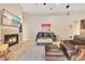 Comfortable living room with fireplace, TV, tile flooring, and view of the lanai at 5335 Bay Side Dr, Orlando, FL 32819