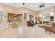 Spacious living room with fireplace, TV, tile flooring, and view of the lanai and dining area at 5335 Bay Side Dr, Orlando, FL 32819