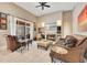 Comfortable living room with fireplace, TV, tile flooring, and view of the lanai at 5335 Bay Side Dr, Orlando, FL 32819
