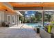 Inviting outdoor patio with a pool, screened enclosure, and comfortable seating at 5335 Bay Side Dr, Orlando, FL 32819