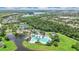 Aerial shot showcasing community amenities including pools, tennis courts, and lush green landscaping at 5944 Lake Melrose Dr, Orlando, FL 32829