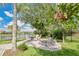 A backyard sitting area with plenty of shade near the lake at 5944 Lake Melrose Dr, Orlando, FL 32829