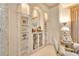 Well-appointed bar area featuring elegant built-in shelves and sophisticated decor at 5944 Lake Melrose Dr, Orlando, FL 32829