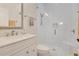 Modern bathroom with stylish vanity, glass shower, and white tile at 5944 Lake Melrose Dr, Orlando, FL 32829
