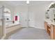 Bright bathroom featuring a soaking tub, shower, and double doors at 5944 Lake Melrose Dr, Orlando, FL 32829
