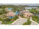 Aerial view of the Vista Lakes clubhouse featuring a pool and lakeside access at 5944 Lake Melrose Dr, Orlando, FL 32829