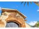 Close-up of the Vista Lakes Residents Club sign on a rustic brick building with arch window at 5944 Lake Melrose Dr, Orlando, FL 32829