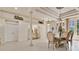 Elegant dining room featuring tiled floors, classic furniture, and ample lighting at 5944 Lake Melrose Dr, Orlando, FL 32829