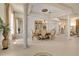 Elegant dining room featuring tiled floors, classic furniture, and a chandelier at 5944 Lake Melrose Dr, Orlando, FL 32829
