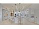 Bright kitchen featuring an island with marble countertops, modern lighting, and white cabinetry at 5944 Lake Melrose Dr, Orlando, FL 32829